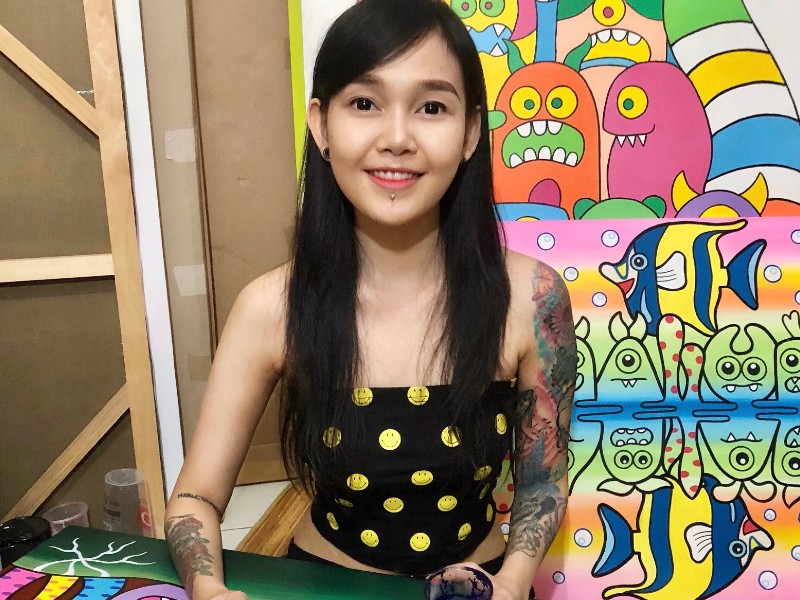 Hana Madness is an Indonesian woman with Javanese blood. She has long black hair, tattoos both on her sleeves, also a piercing under her lip. 