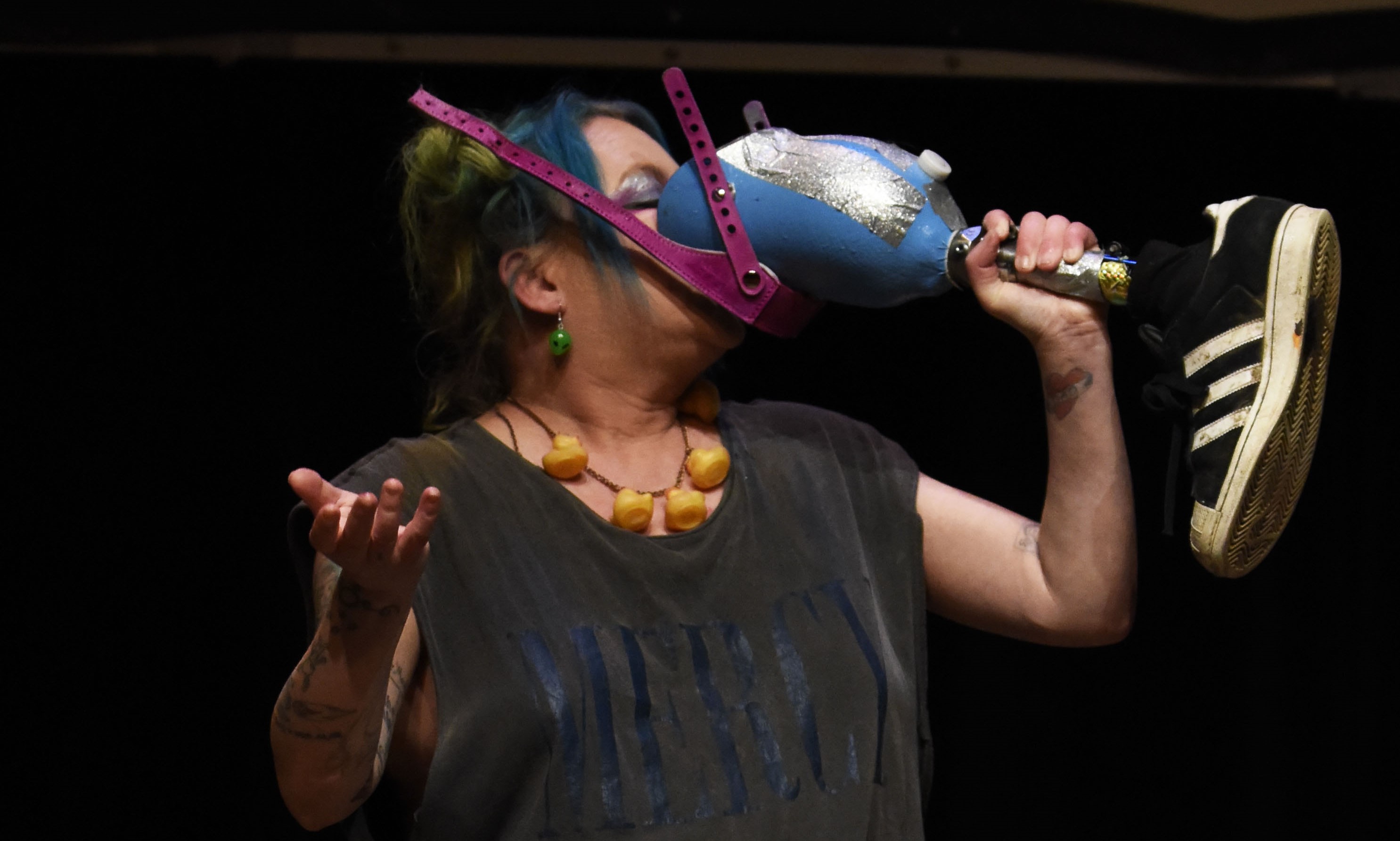 Jackie Hagan drinks out of her prosthetic leg.